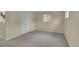 Cozy bedroom with carpet, closet space, and a window letting in natural light at 1330 Quari St, Aurora, CO 80011
