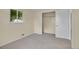 Bright bedroom featuring a closet, plush carpeting, and natural light from the window at 1330 Quari St, Aurora, CO 80011
