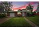 Charming brick home with a well-maintained lawn and landscaping at 1330 Quari St, Aurora, CO 80011
