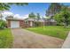 Quaint brick home with lush front lawn and long driveway, perfect for parking at 1330 Quari St, Aurora, CO 80011
