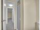 Hallway leading to bedroom with a shower to the right at 1330 Quari St, Aurora, CO 80011