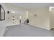 Spacious living room with soft carpet, and built in shelving, creating a cozy atmosphere at 1330 Quari St, Aurora, CO 80011