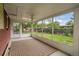 Bright sunroom featuring multiple large windows, ceiling fan and lights and a brown patterned rug at 1330 Quari St, Aurora, CO 80011
