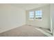 Bright bedroom with neutral carpet, two windows that provide an abundance of natural light at 16552 E 109Th Ave, Commerce City, CO 80022