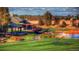 Lush golf course and Buffalo Run Clubhouse with scenic landscapes and serene water features at 16552 E 109Th Ave, Commerce City, CO 80022