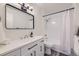 Recently updated bathroom featuring modern fixtures, neutral paint, a shower and modern vanity at 3550 S Harlan St # 182, Denver, CO 80235