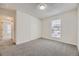 This bedroom features neutral paint, plush carpet, and a closet at 3550 S Harlan St # 182, Denver, CO 80235