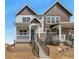 Charming two-story home with stone accents and a welcoming front porch and new landscaping at 22272 E 7Th Pl, Aurora, CO 80018