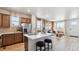 Well-designed kitchen open to the living area, featuring modern appliances and a center island with bar stools at 22272 E 7Th Pl, Aurora, CO 80018
