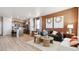 A cozy living room featuring stylish decor, a comfortable sofa, and an adjacent modern kitchen at 22272 E 7Th Pl, Aurora, CO 80018