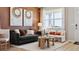 A stylish living room with comfortable seating, natural light, and decorative art pieces on the walls at 22272 E 7Th Pl, Aurora, CO 80018