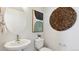 Stylish powder room featuring modern decor and a sleek sink design at 22272 E 7Th Pl, Aurora, CO 80018