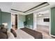 Bedroom showcases a bathroom and living room through open doorway at 4899 S Dudley St # 15G, Littleton, CO 80123