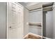 View of a closet featuring shelving and a white paneled door with a silver handle at 4899 S Dudley St # 15G, Littleton, CO 80123