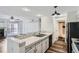 Kitchen and living area featuring a breakfast bar at 4899 S Dudley St # 15G, Littleton, CO 80123