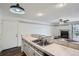 Charming kitchen featuring stainless steel sink, black and white accents, and wood-look flooring at 4899 S Dudley St # 15G, Littleton, CO 80123