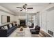Bright living space with a fireplace, balcony, built-in shelving, and ample storage at 4899 S Dudley St # 15G, Littleton, CO 80123