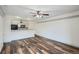 Spacious living room with an open kitchen and ceiling fan at 4899 S Dudley St # 15G, Littleton, CO 80123