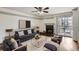 Cozy living room featuring a fireplace, balcony access, and comfortable seating arrangements at 4899 S Dudley St # 15G, Littleton, CO 80123
