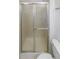 Clean, well-maintained shower with sliding doors and a toilet, offering a functional and practical space at 1584 S Salem Cir, Aurora, CO 80012