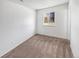 Bright bedroom with neutral carpet, a window view, and freshly painted white walls for a modern aesthetic at 1584 S Salem Cir, Aurora, CO 80012