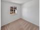 Well-lit bedroom with neutral carpet, a window view, and freshly painted white walls for a modern aesthetic at 1584 S Salem Cir, Aurora, CO 80012