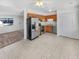 Well-lit kitchen featuring tile floors, stainless steel appliances, and ample cabinet space at 1584 S Salem Cir, Aurora, CO 80012