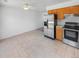 Open kitchen and breakfast area with stainless steel appliances and lots of natural light at 1584 S Salem Cir, Aurora, CO 80012