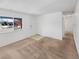 Bright living room with neutral walls, carpet and large window at 1584 S Salem Cir, Aurora, CO 80012