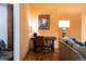 Home office setup with stylish desk and lamp, providing a functional workspace at 1143 Auraria Pkwy # 203, Denver, CO 80204