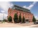 Beautiful exterior view showcasing a red brick building with a modern glass addition, capturing its unique architectural blend at 1143 Auraria Pkwy # 203, Denver, CO 80204