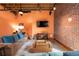 Comfortable living room with modern furnishings and a warm, inviting color palette at 1143 Auraria Pkwy # 203, Denver, CO 80204