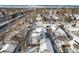 Aerial view of the house and surrounding neighborhood in winter at 4820 Newton St, Denver, CO 80221