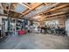 Oversized garage with ample storage shelving and a boxing bag at 4820 Newton St, Denver, CO 80221