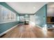 Living room with hardwood floors and fireplace at 4820 Newton St, Denver, CO 80221