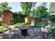 Private backyard patio featuring comfortable egg chairs and cozy fire pit at 1661 Oneida St, Denver, CO 80220