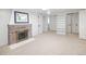 Basement bonus room with a fireplace, carpeted floors, and ample space at 1661 Oneida St, Denver, CO 80220