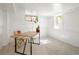 Finished basement space featuring a desk, chair and natural light at 1661 Oneida St, Denver, CO 80220