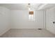 Clean, carpeted basement space with white walls and ample lighting at 1661 Oneida St, Denver, CO 80220