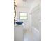 Bright bathroom featuring a blue vessel sink, modern fixtures, and a shower/tub combo at 1661 Oneida St, Denver, CO 80220