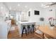 Bright kitchen with an island, white cabinets, stainless steel appliances, and chalkboard at 1661 Oneida St, Denver, CO 80220