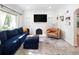 Cozy living room with fireplace, creating a warm and inviting space for relaxation at 1661 Oneida St, Denver, CO 80220