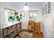Charming playroom featuring a bookshelf, natural light, and a whimsical chandelier at 1661 Oneida St, Denver, CO 80220