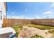 Well-maintained backyard with a wooden fence, offering a secure outdoor space at 551 S Main St, Byers, CO 80103