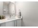 Stylish bathroom vanity with white countertop, modern faucet, and decorative accents at 551 S Main St, Byers, CO 80103