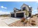 Charming two-story home with a two-car garage and well-maintained front yard at 551 S Main St, Byers, CO 80103
