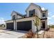 Charming two-story home with a two-car garage and well-maintained front yard at 551 S Main St, Byers, CO 80103