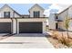 Charming two-story home with a two-car garage and well-maintained front yard at 551 S Main St, Byers, CO 80103