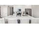 Bright kitchen with a spacious island and modern stainless steel appliances at 551 S Main St, Byers, CO 80103