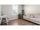This room has a desk, chair, and sofa, offering a flexible workspace with natural light at 551 S Main St, Byers, CO 80103